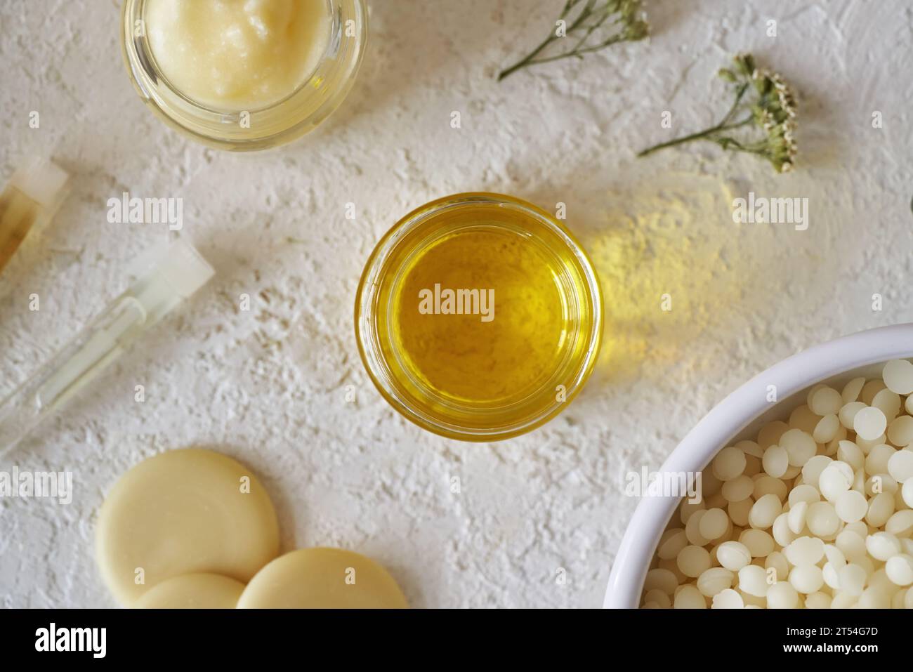 Essential oil with shea butter, beeswax pellets and cocoa butter on