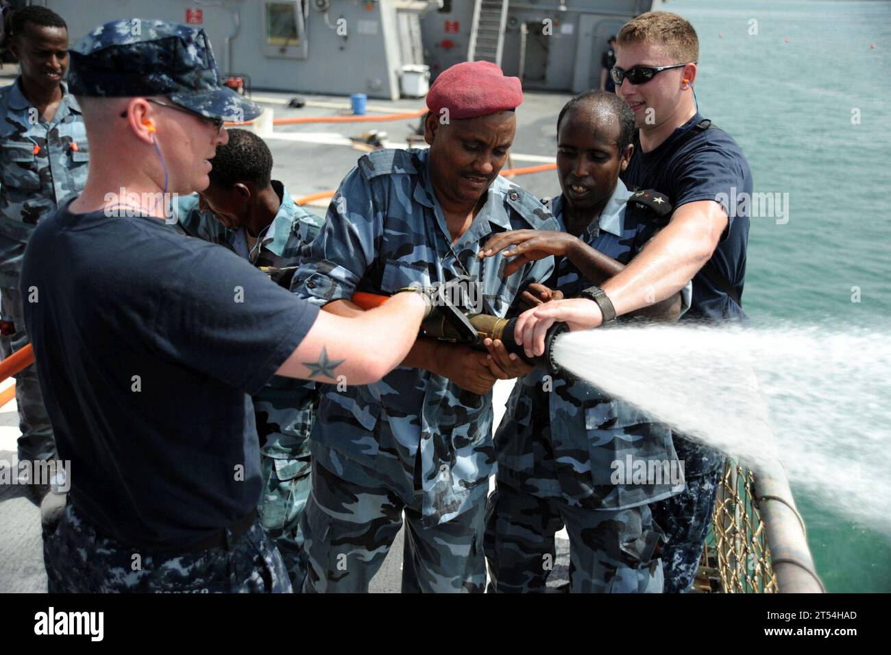 Damage Control, ddg-51, Djibouti, fighting, fire, hose handling, training, uss arleigh burke Stock Photo