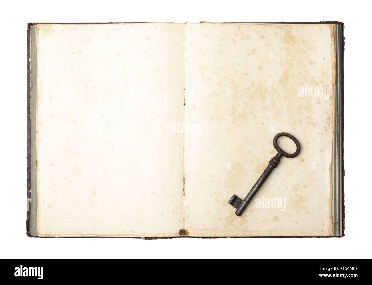 Antique key on old book. Symbol of the secret. Old antique book with keys on empty sheet. Stock Photo
