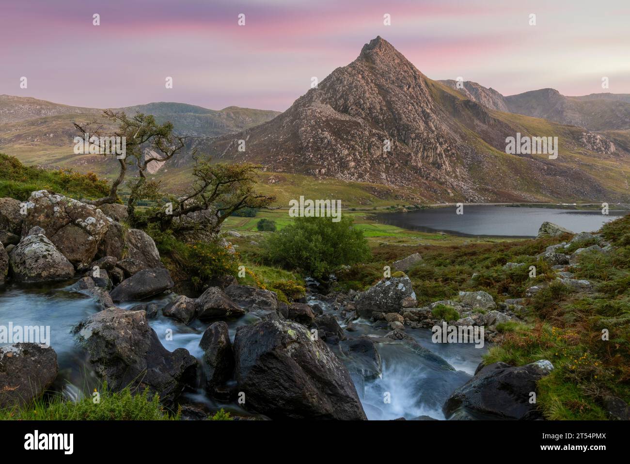 The Afon Lloer is a river in Snowdonia, North Wales, that flows towards the mountain Tryfan. Stock Photo
