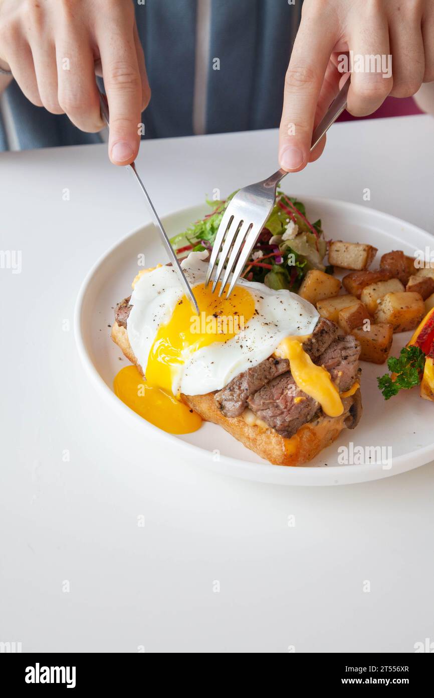 Breakfast egg and roast beef open faced sandwich served at a cafe restaurant Stock Photo Alamy