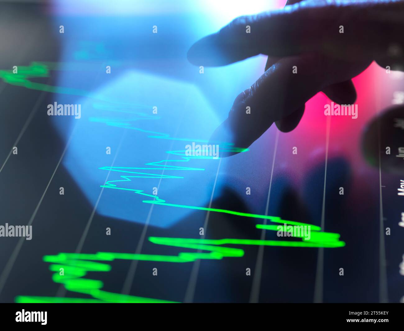 Analysts viewing financial performance data on touch screen Stock Photo