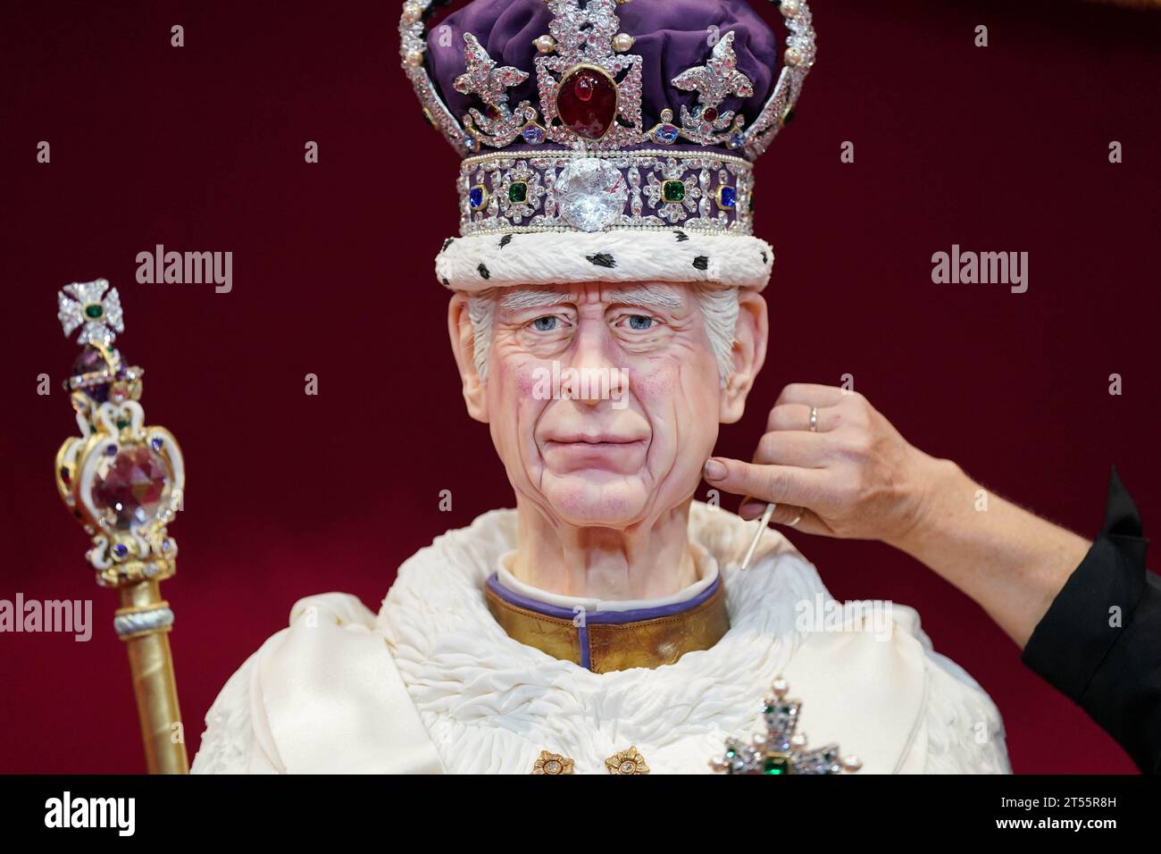 The finishing touches are applied to a lifesize cake figure of King