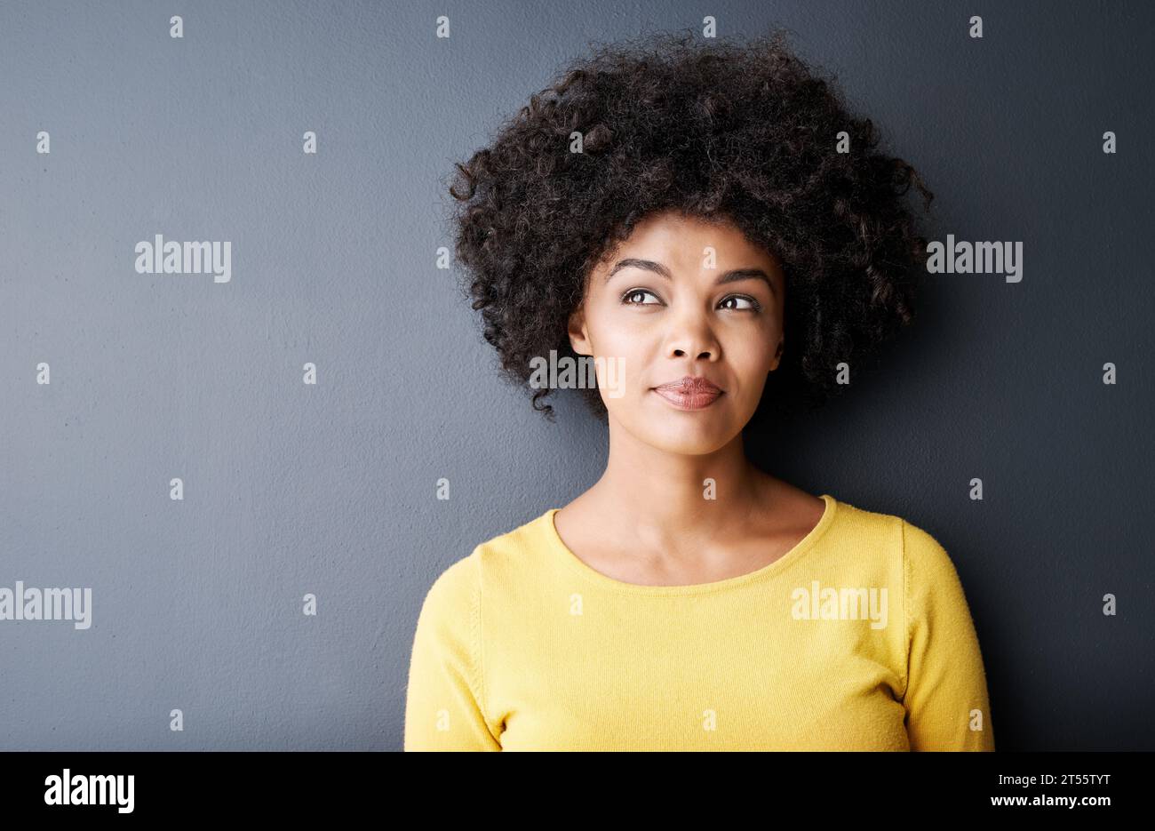 Positive girl thinking solving hi-res stock photography and images - Alamy