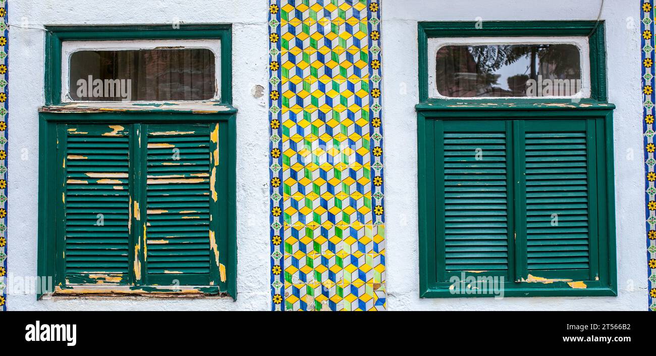 Weathered Window Feature Two weathered windows over tile glazed facade. Belem neighborhood ...