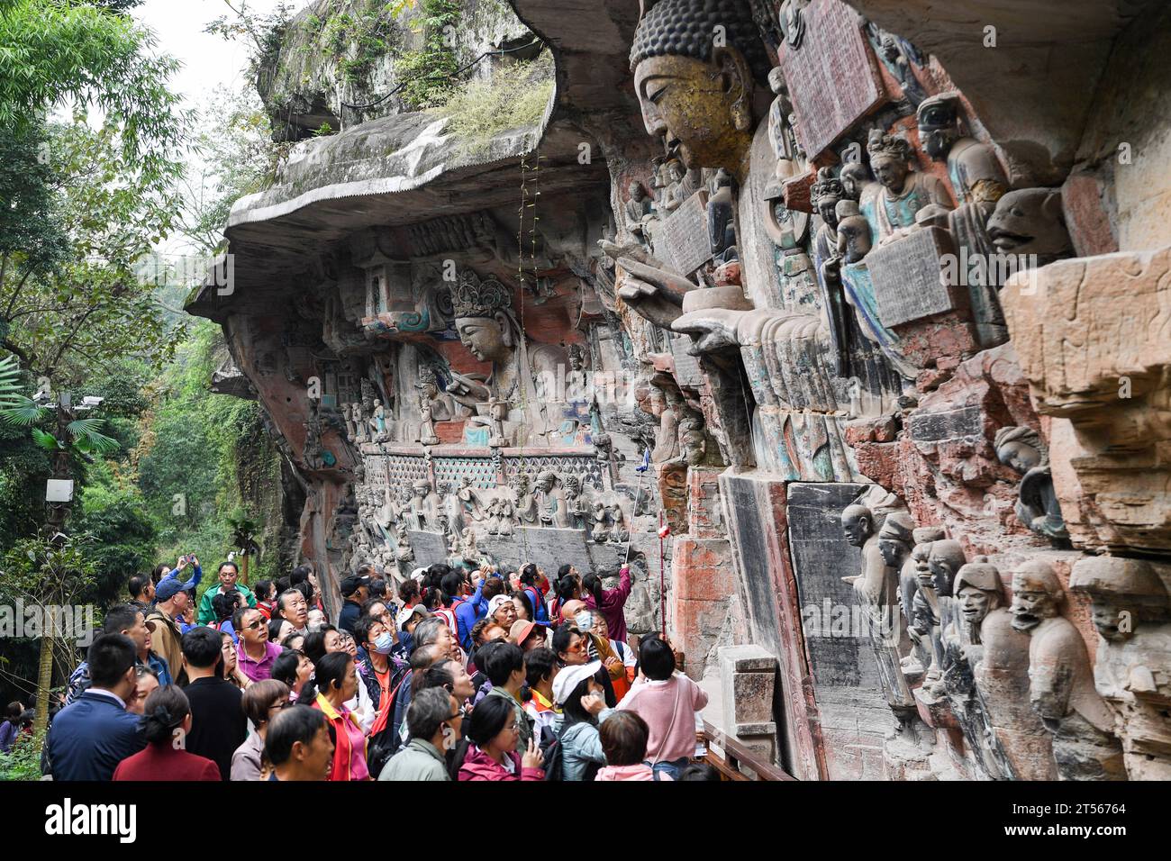 (231103) -- CHONGQING, Nov. 3, 2023 (Xinhua) -- People visit the scenic spot of Dazu Rock Carvings in Chongqing, southwest China, Nov. 1, 2023. The scenic spot of Dazu Rock Carvings saw about one million tourist trips made from January to October this year, up 358.7 percent year on year.    The Dazu Rock Carvings were placed on the World Heritage List by the United Nations Educational, Scientific and Cultural Organization (UNESCO) in 1999. (Xinhua/Wang Quanchao) Stock Photo