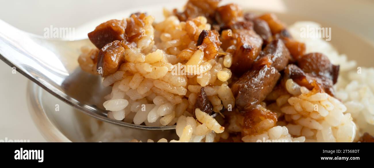 Braised meat rice, stewed pork over cooked rice in Taiwanese restaurant. Stock Photo