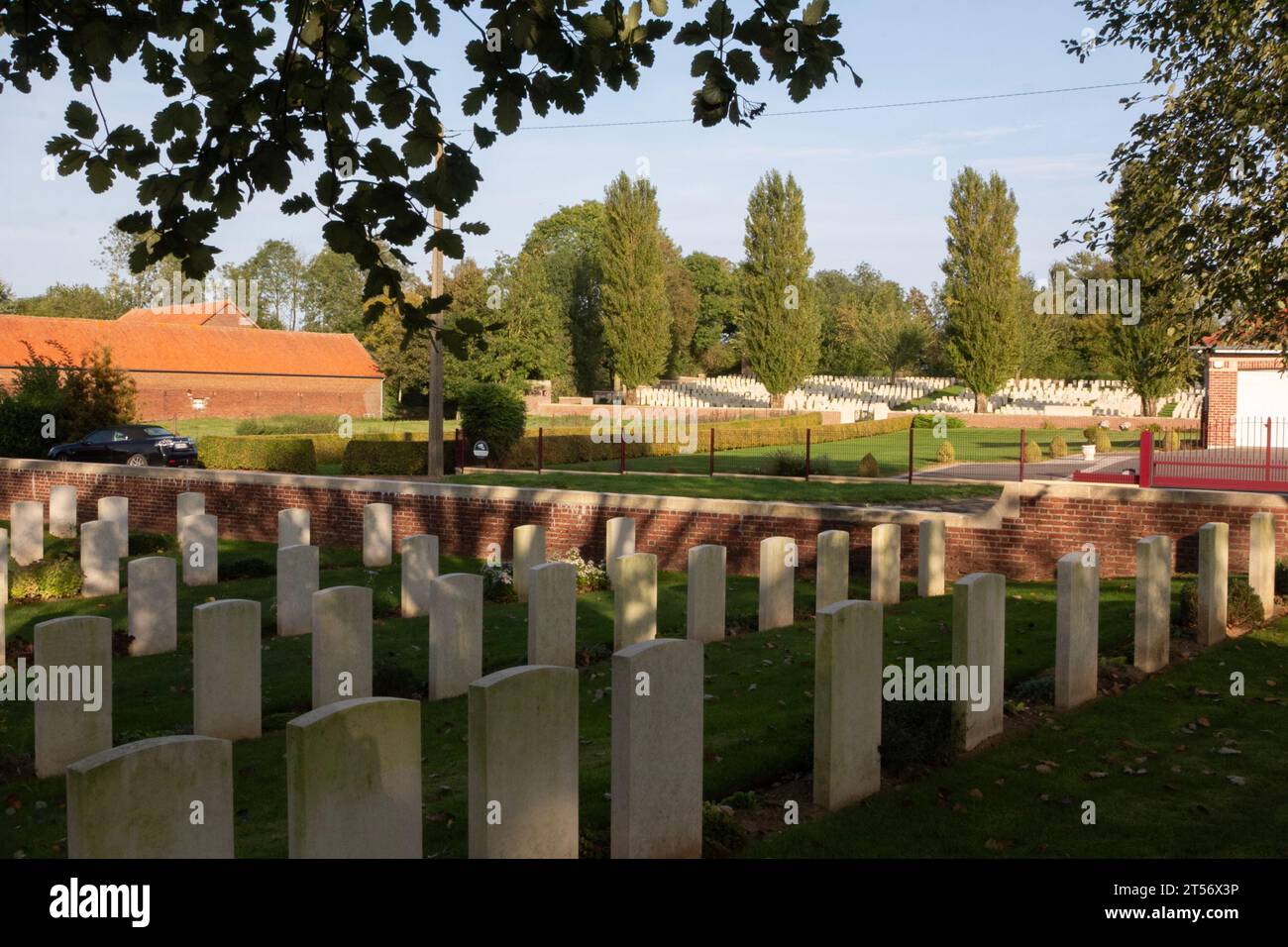 The WW1 Hermies British Cemetery and the Hermies Hill British Cemetery across the road under the poplar trees in northern France. Stock Photo