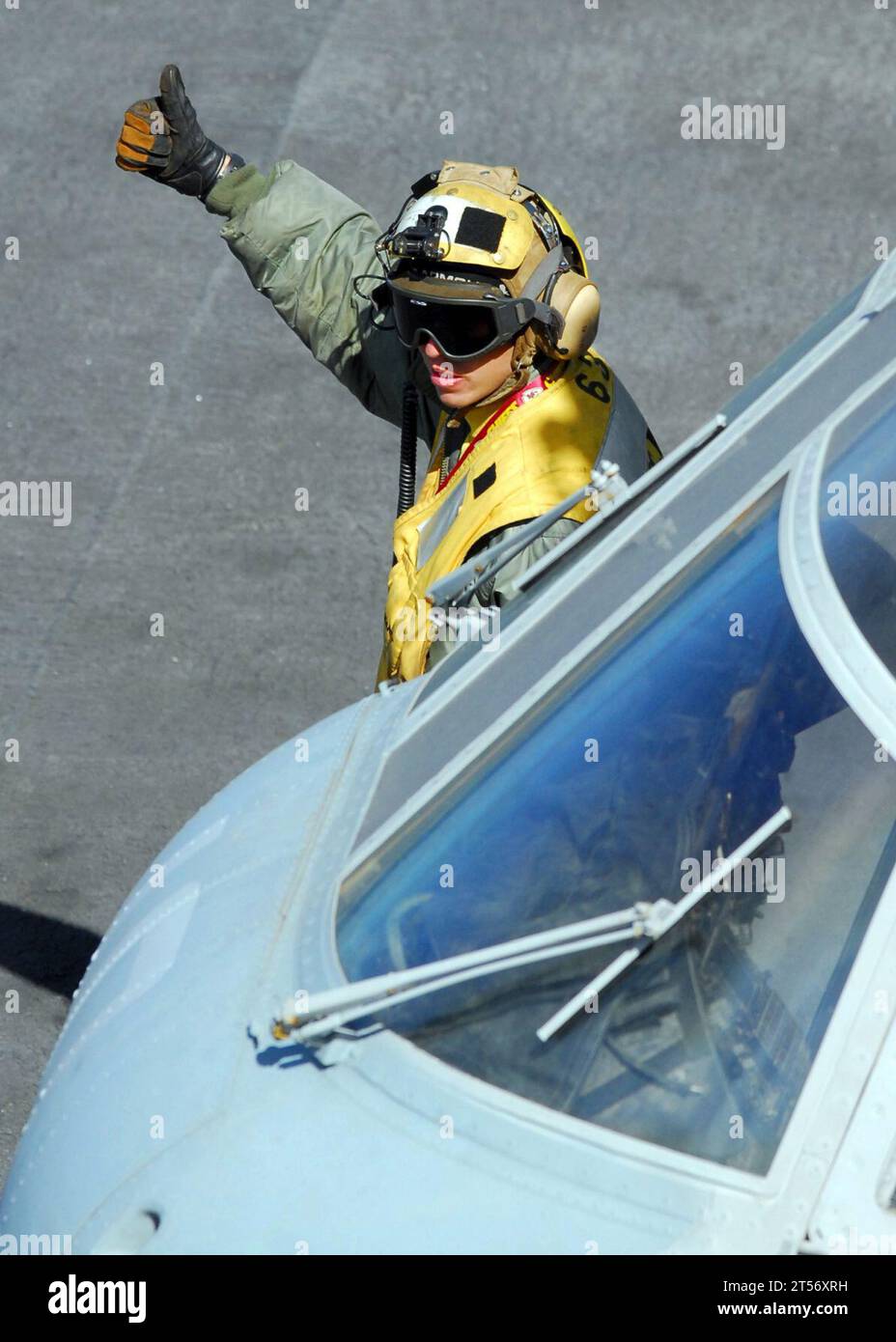 US Navy A flight deck crewman gives the thumbs up signal to launch ...
