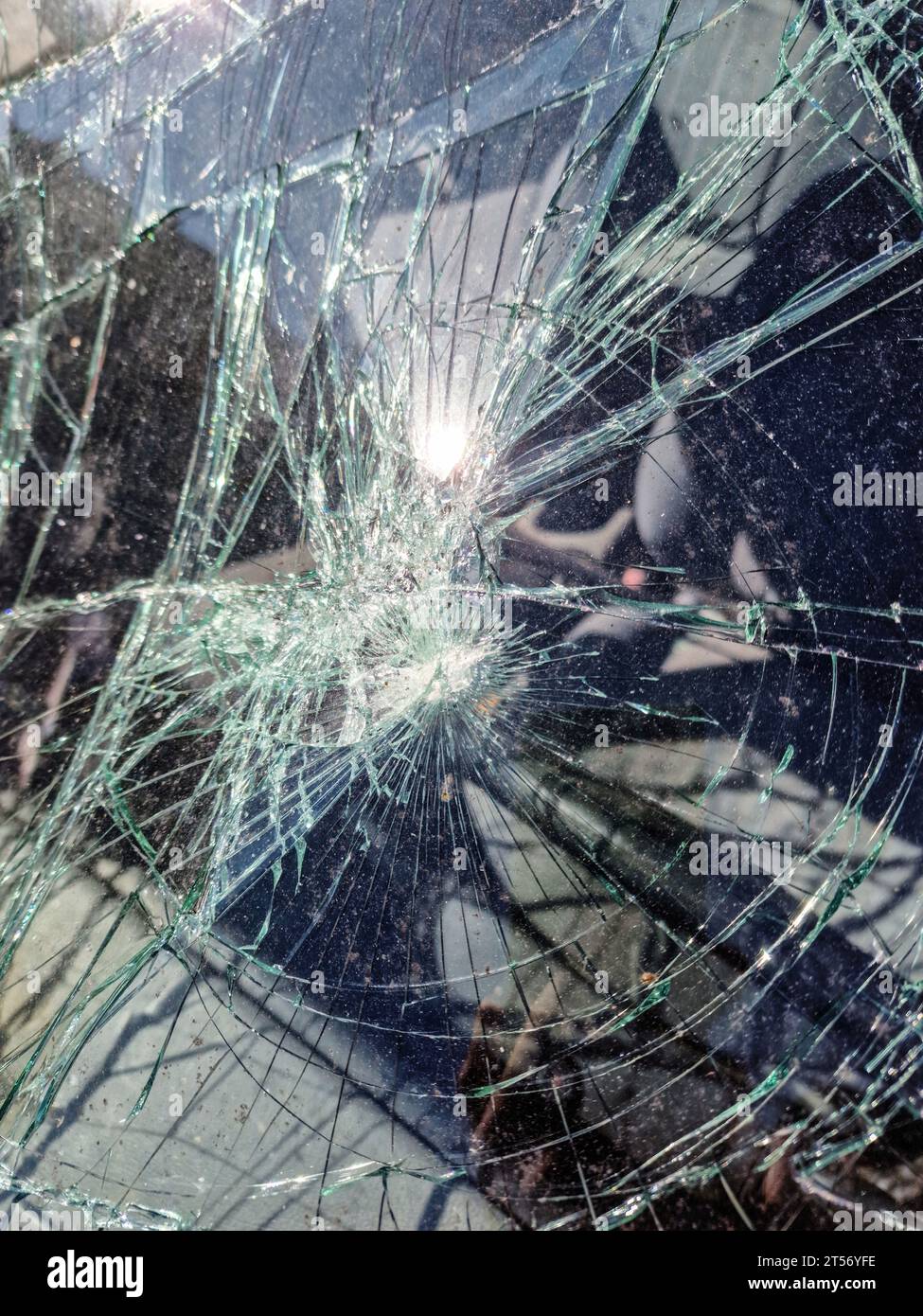 Broken Car Windscreen Or Windshield Window. Smashed Front Glass Stock Photo