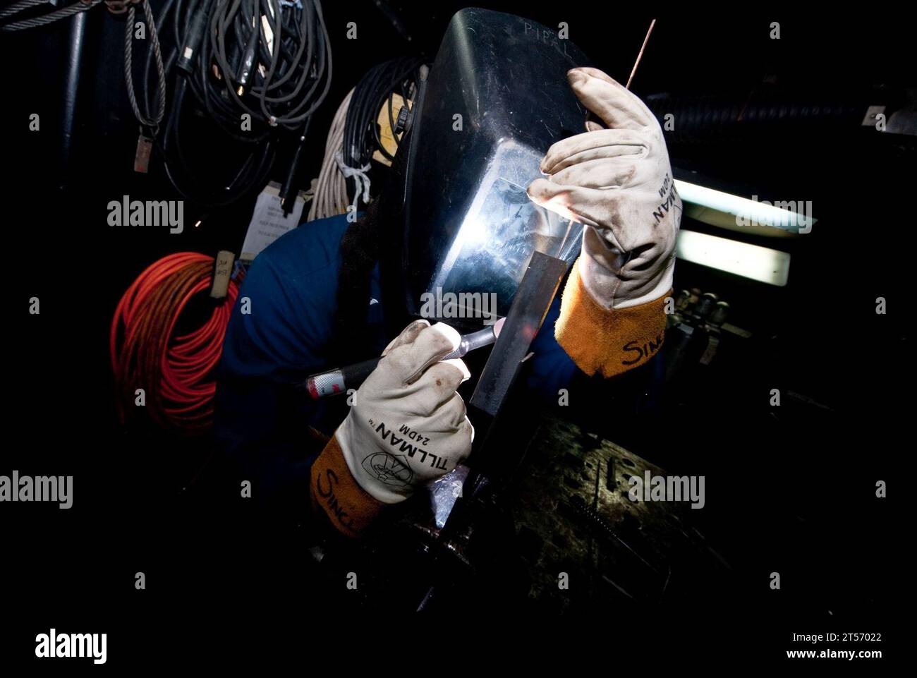 US Navy A Sailor practices welding for a shipboard qualification.jpg ...
