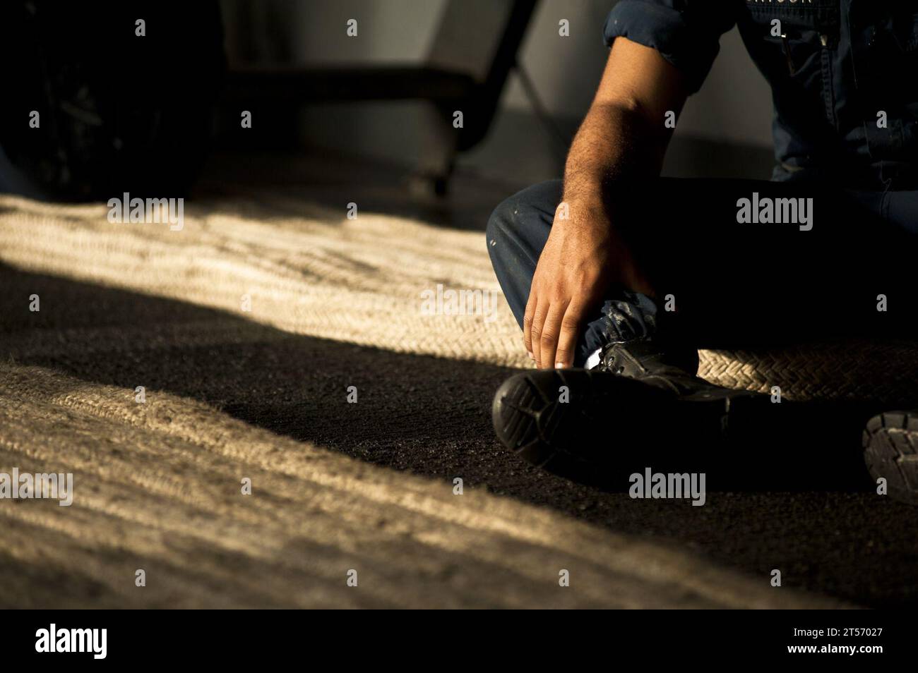 US Navy A Sailor prepares to handle line as part of a sea and anchor ...