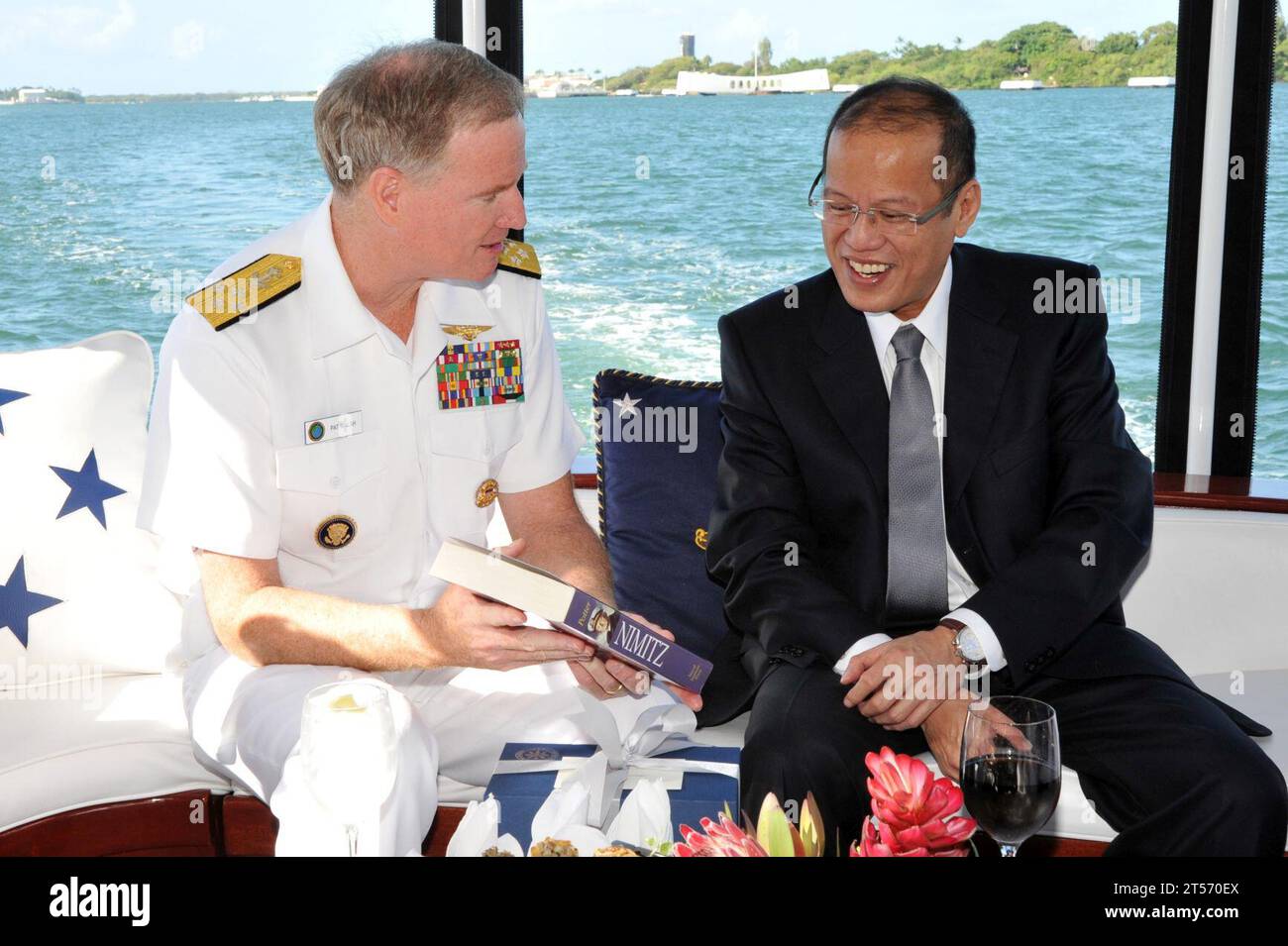 US Navy Adm. Patrick Walsh, commander of U.S. Pacific Fleet, presents President of the Philippines Benigno Aquino III a biograph.jpg Stock Photo