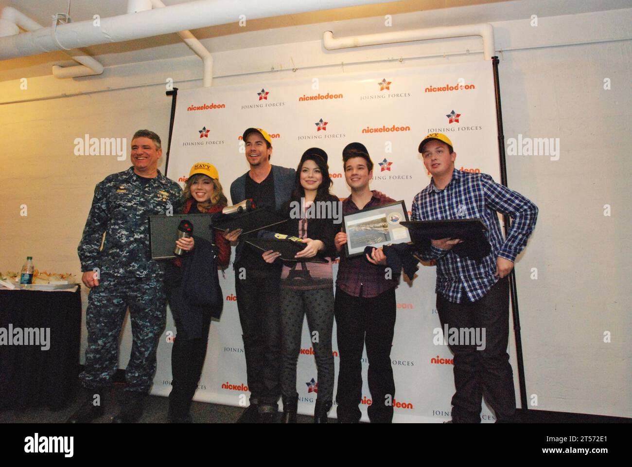 US Navy Cast members of Nickelodeon's TV show iCarly pose for a  with Stock Photo