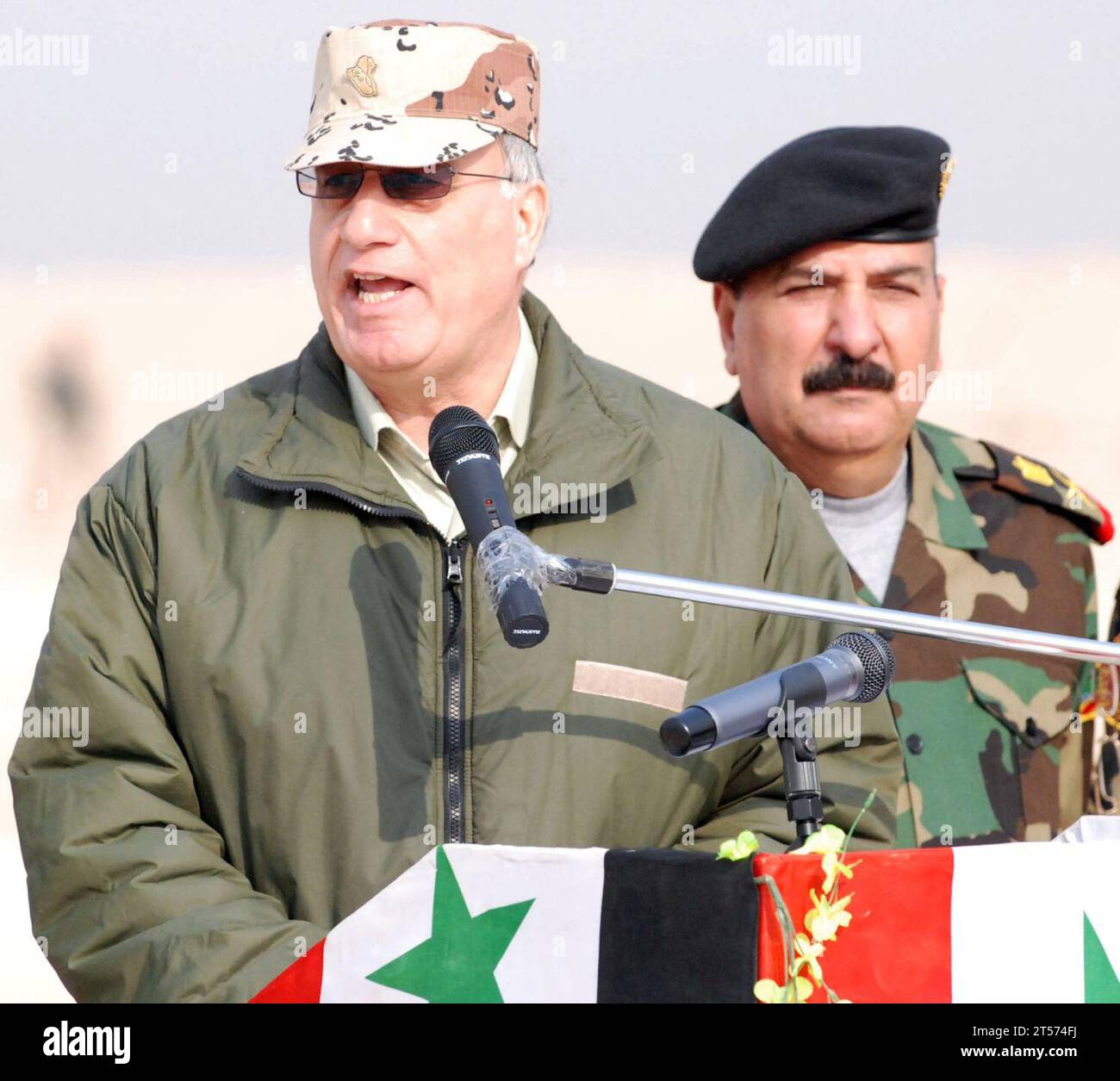 US Navy Iraqi Minister of Defence Abd al-Qadir al-Mufriji delivers a speech to the members of Iraqi Army 2nd Brigade during the graduation ceremony held at Besmaya Range Complex.jpg Stock Photo