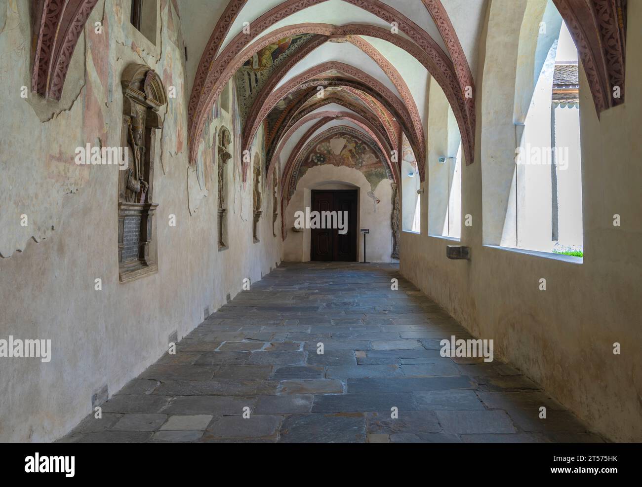 Novacella Augustinian Abbey. The Gothic cloister with from valuable frescoes, Brixen (Bressanone), South Tyrol, Trentino Alto Adige, northern Italy. Stock Photo