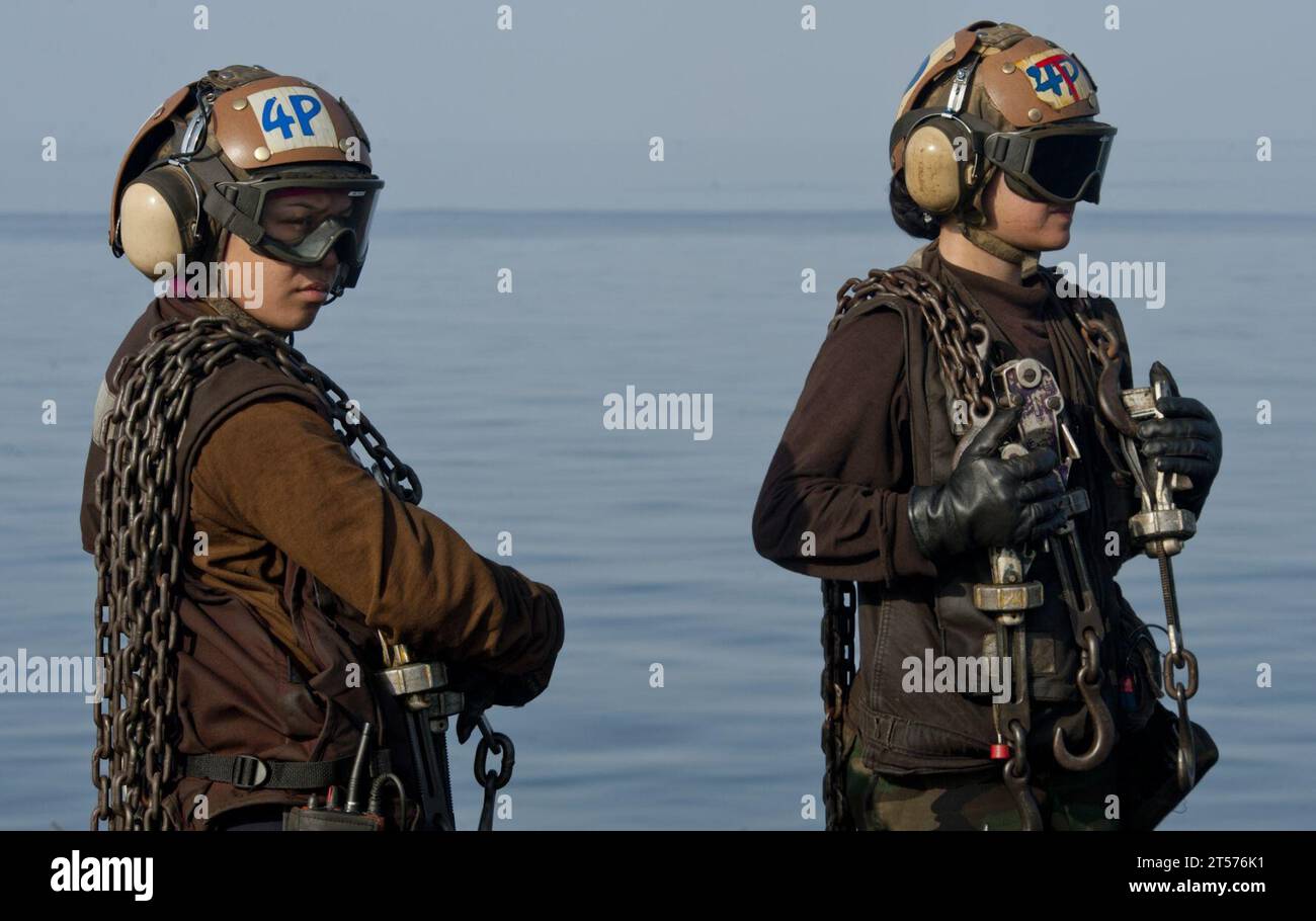 US Navy Plane captains from the Golden Dragons of Strike Fighter Squadron (VFA) 192 stand by during aircraft recovery operations.jpg Stock Photo