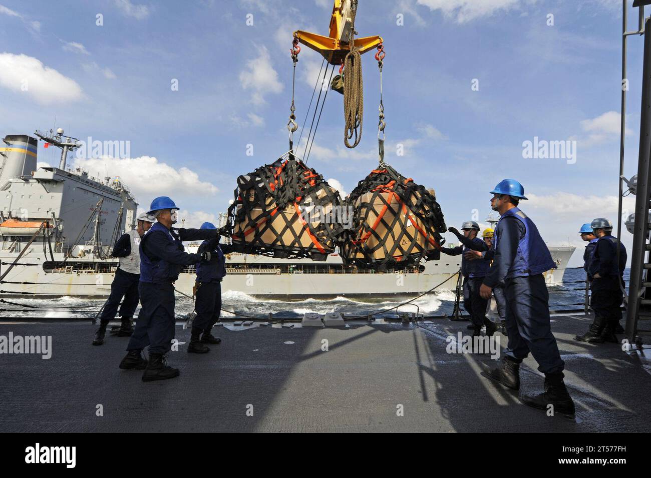US Navy Sailors aboard the Arleigh Burke-class guided-missile destroyer ...