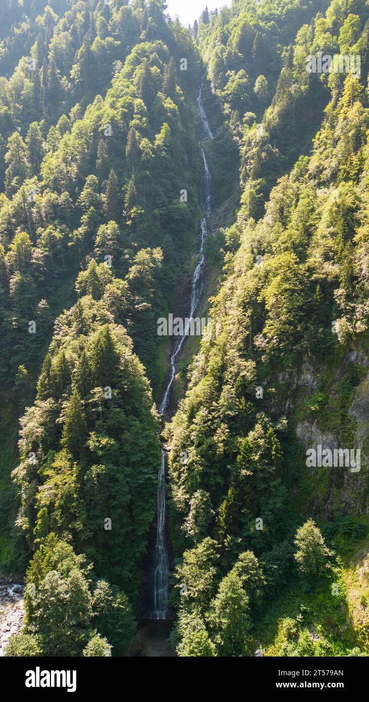 Tar stream cloud waterfall. Aerial view of waterfall flowing over mountain covered with forest. Natural beauties of Rize. Tourist places of Turkey. lo Stock Photo