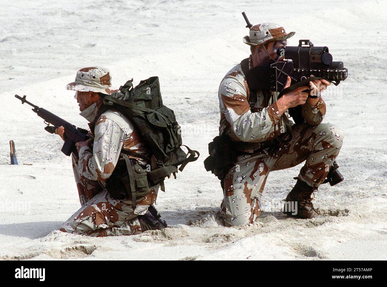 US Navy SEALs with laser designator closeup.jpg Stock Photo