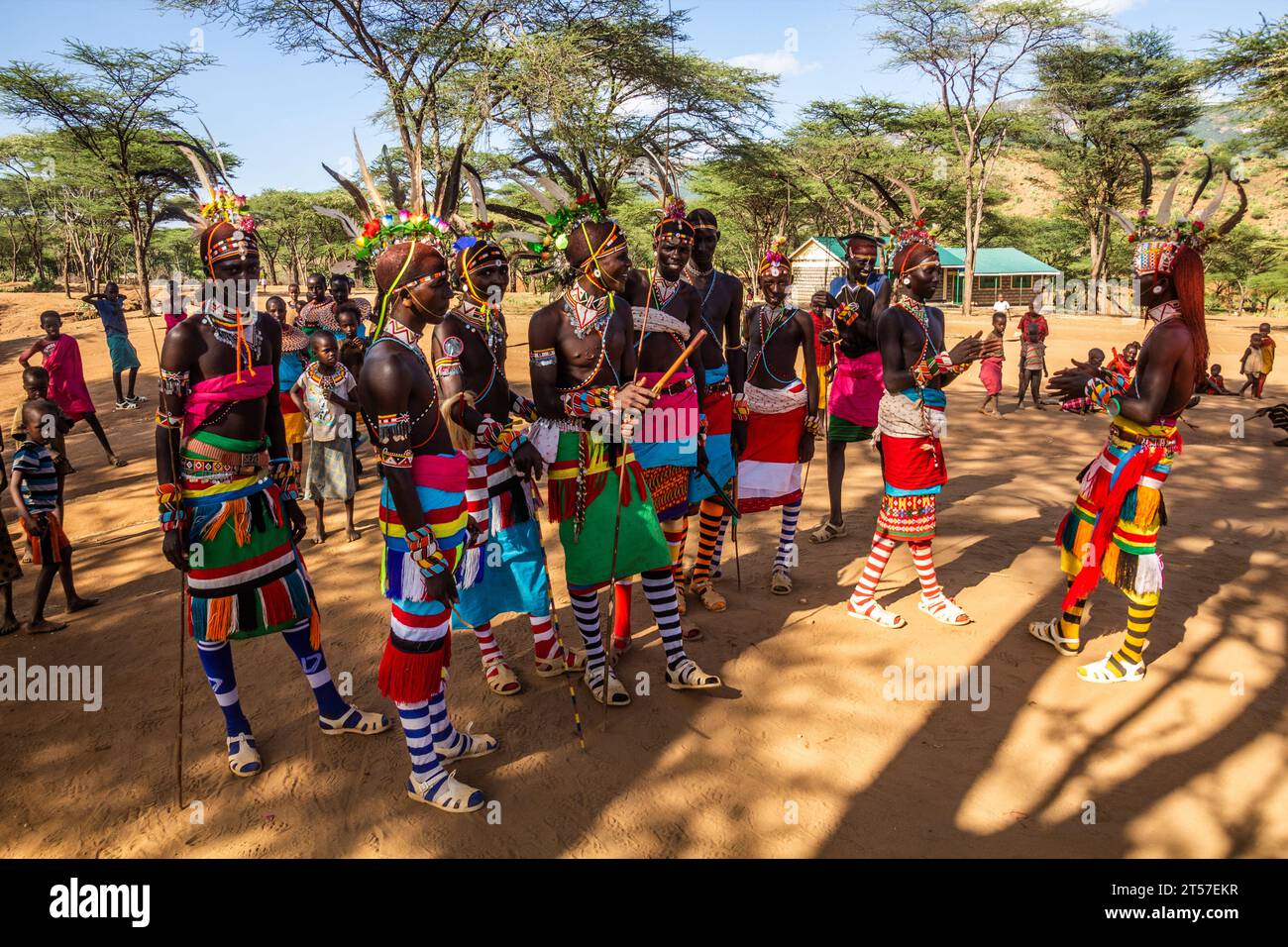 SOUTH HORR, KENYA - FEBRUARY 12, 2020: Group of Samburu tribe young men dancing wearing colorful headpieces made of ostrich feathers after their circu Stock Photo