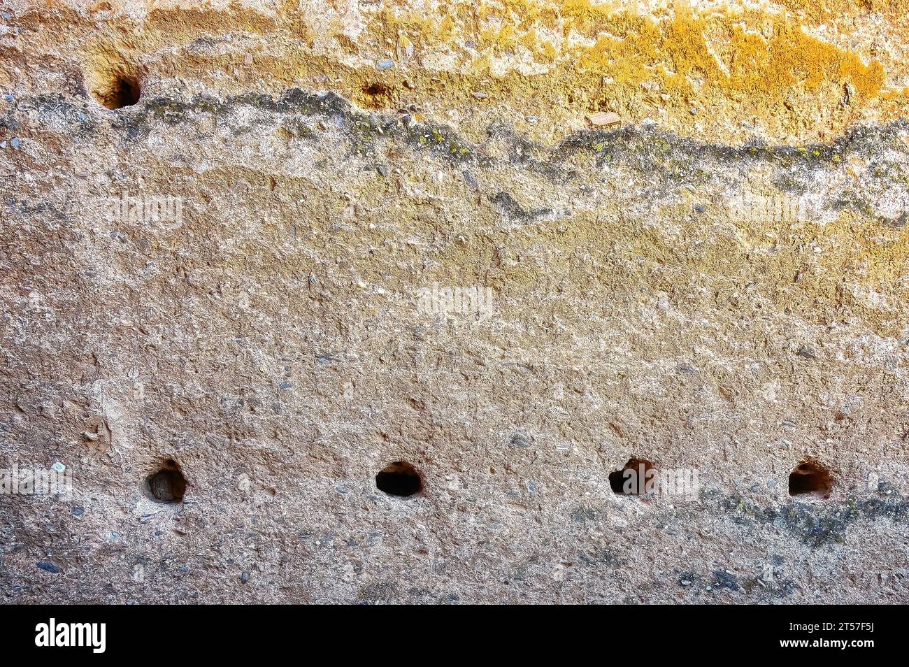 Granada, Spain, holes in an ancient wall. Architectural detail or feature of Alhambra fortress. Stock Photo