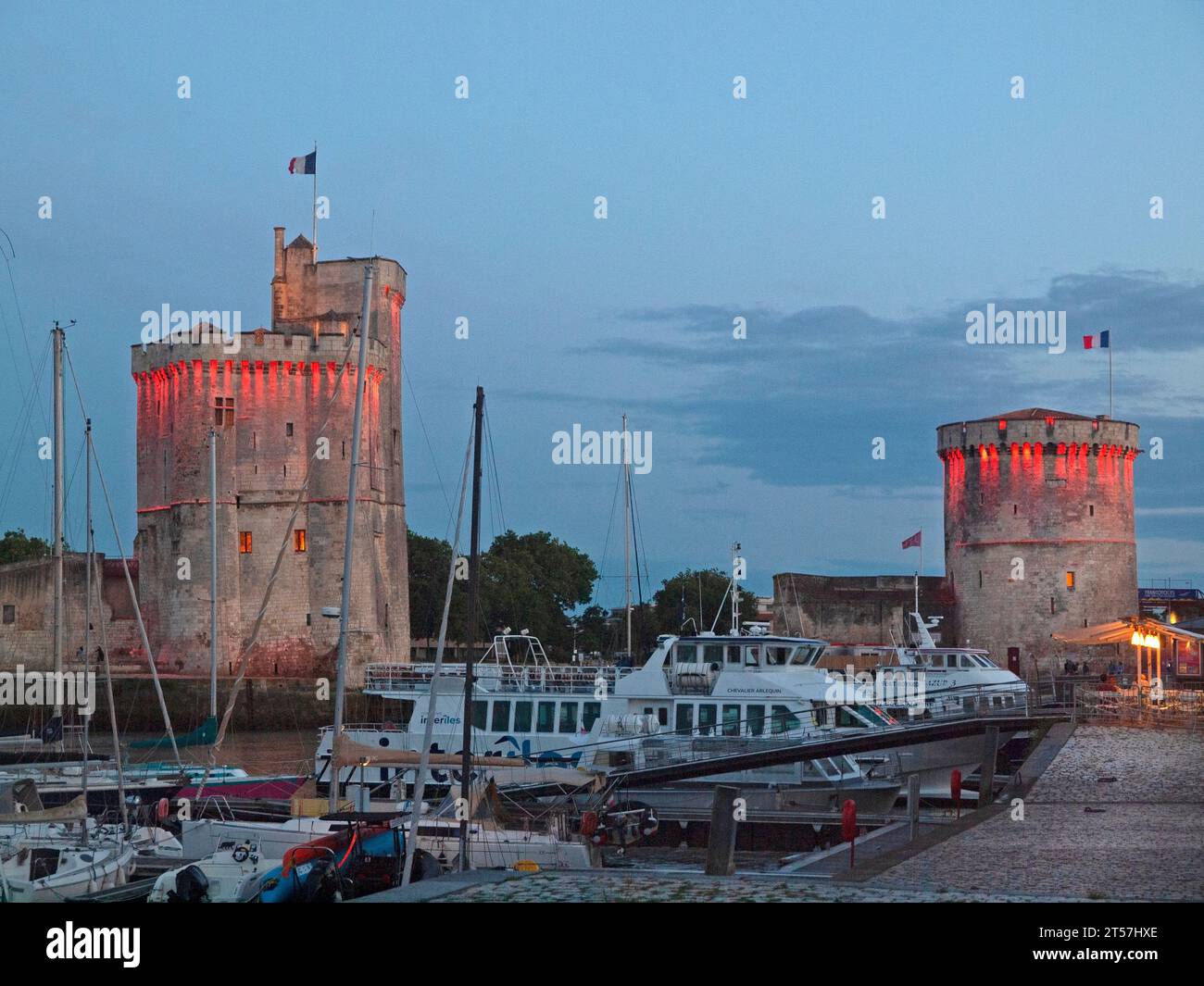 The towers of La Chaine and St Nicholas at the entrance to the port of La Rochelle, France Stock Photo