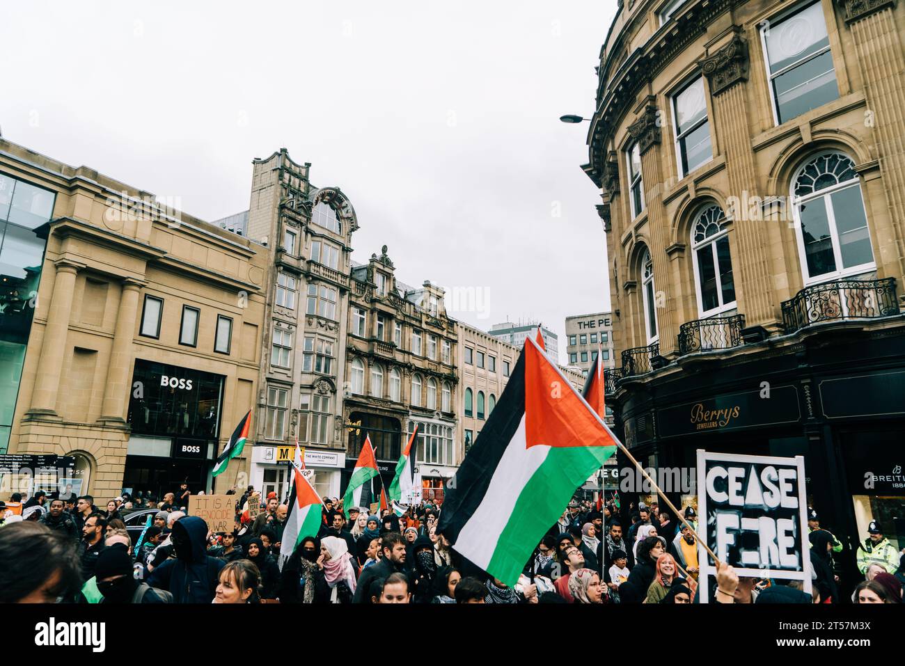 Protesters wave Palestine flags and home made signs in city centre at Gaza ceasefire march. Newcastle Upon Tyne, England, UK - Oct 28 2023. Stock Photo