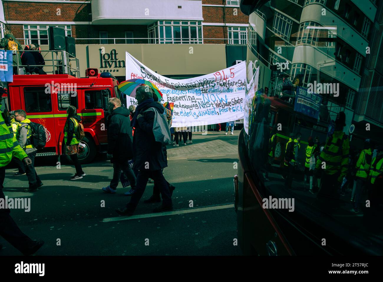 Participants gather and march during the SOS NHS demonstration in London. Stock Photo