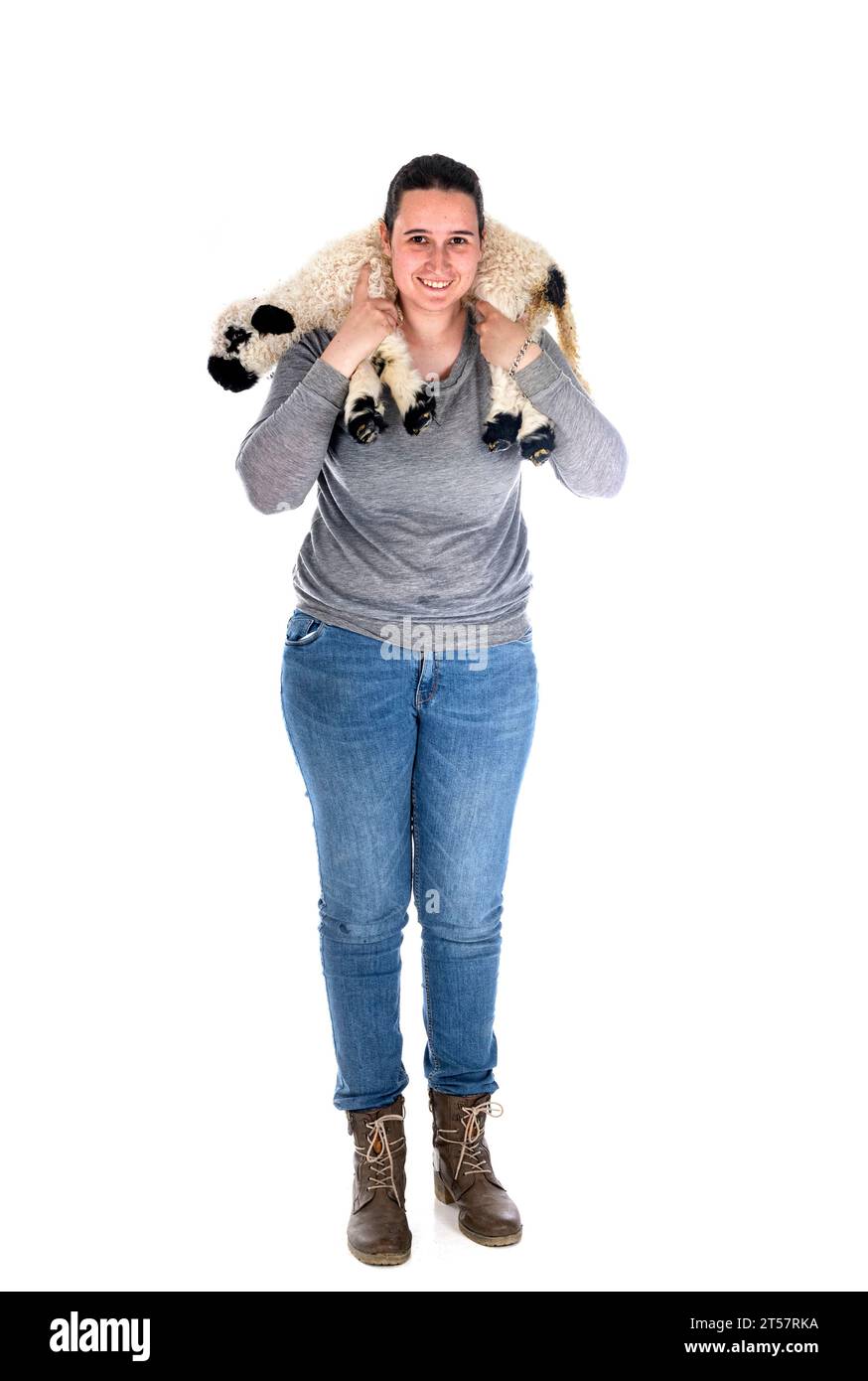 lamb Valais Blacknose and woman farmer in front of white background Stock Photo