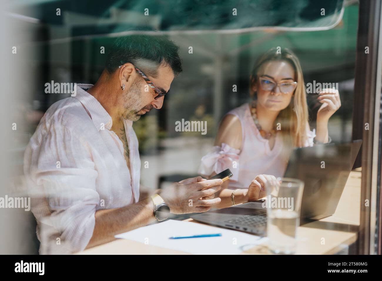 Collaborative Business Workshop: Multicultural Leaders Discussing Better Results and Efficiency Stock Photo