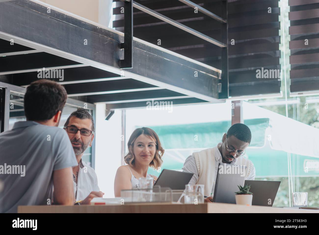 Efficient Business Team Analyzing Reports and Planning for Future Success Stock Photo