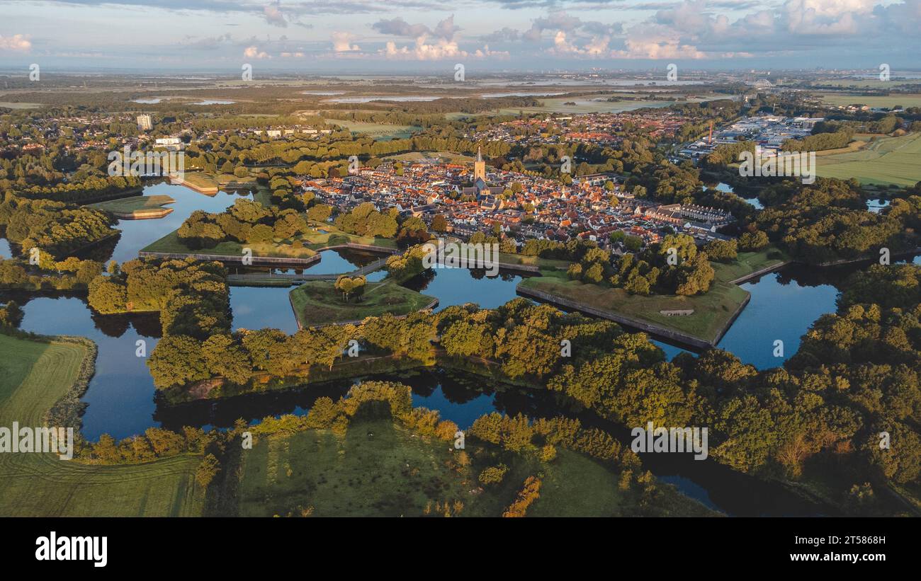 Aerial view of the historic town of Naarden and its star-shaped canals during sunrise. Dutch history. Stock Photo