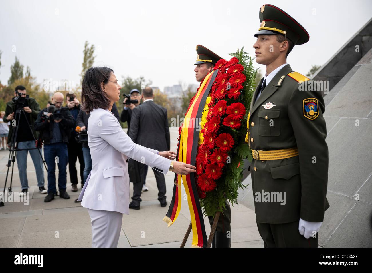 Eriwan, Armenia. 03rd Nov, 2023. Annalena Baerbock (Bündnis 90/Die Grünen), Federal Minister for Foreign Affairs, directs the wreath ribbon. The Zizernakaberd memorial commemorates the Armenian genocide of 1915. Credit: Hannes P. Albert/dpa/Alamy Live News Stock Photo