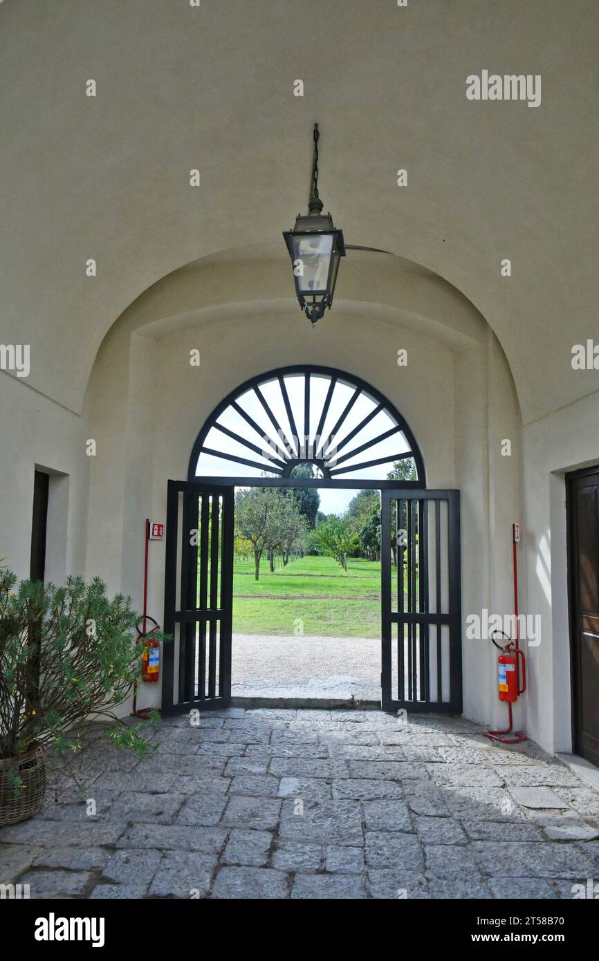 Entrance to the garden inside the park around the 18th century Bourbon palace in Naples, Italy. Stock Photo