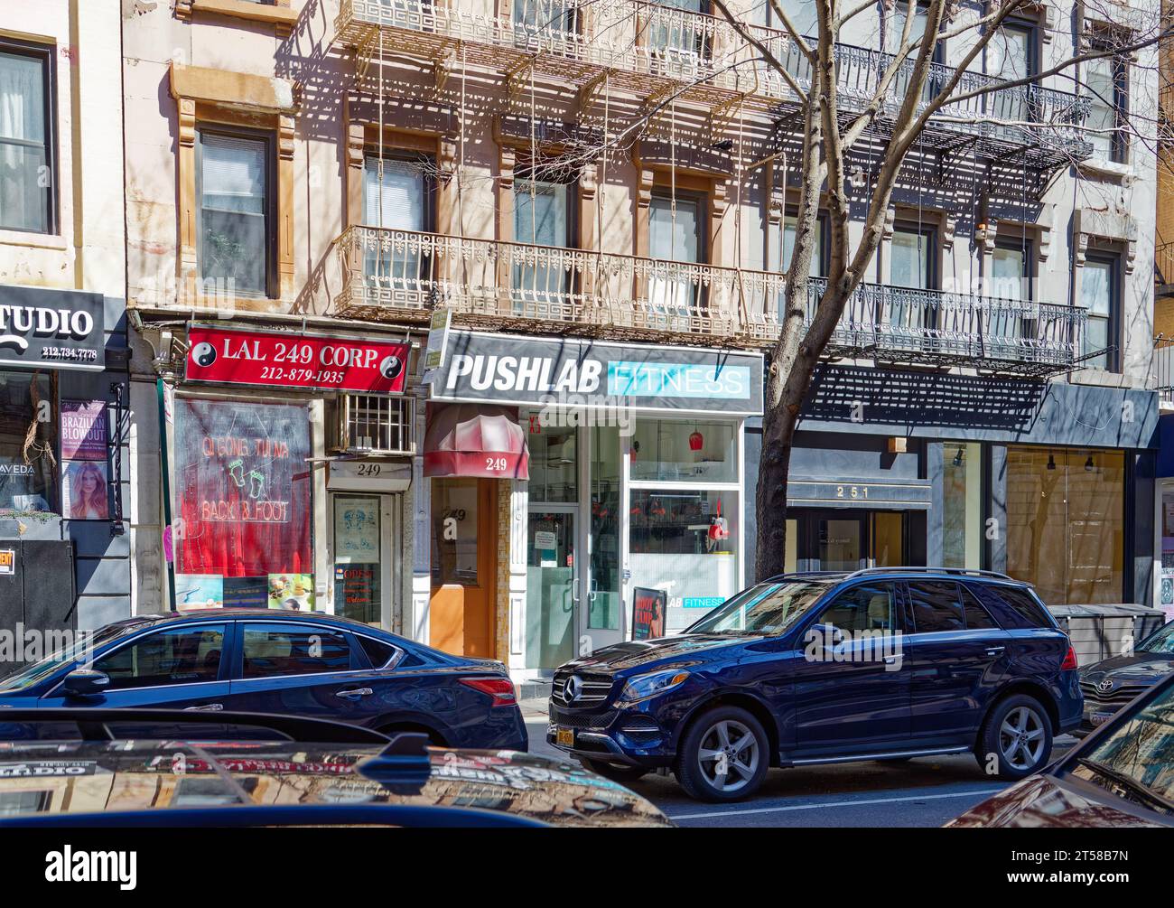 249 and 251 East 77th Street are mirror twin fivestory brownstone
