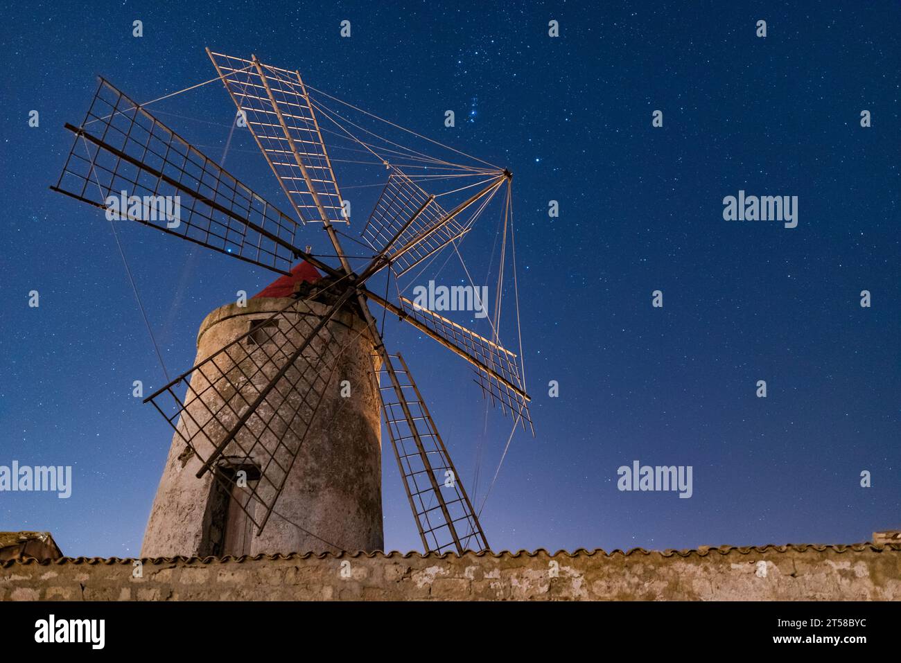 Night view of a traditional windmill, salt pans of Trapani Stock Photo