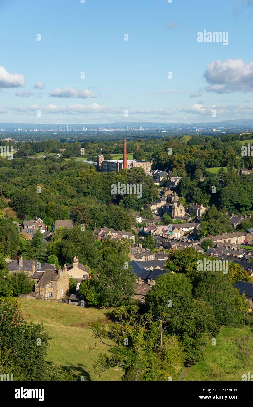 Clarence Mill in Bollington near Macclesfield, Cheshire, England. The city of Manchester in the distance. Stock Photo