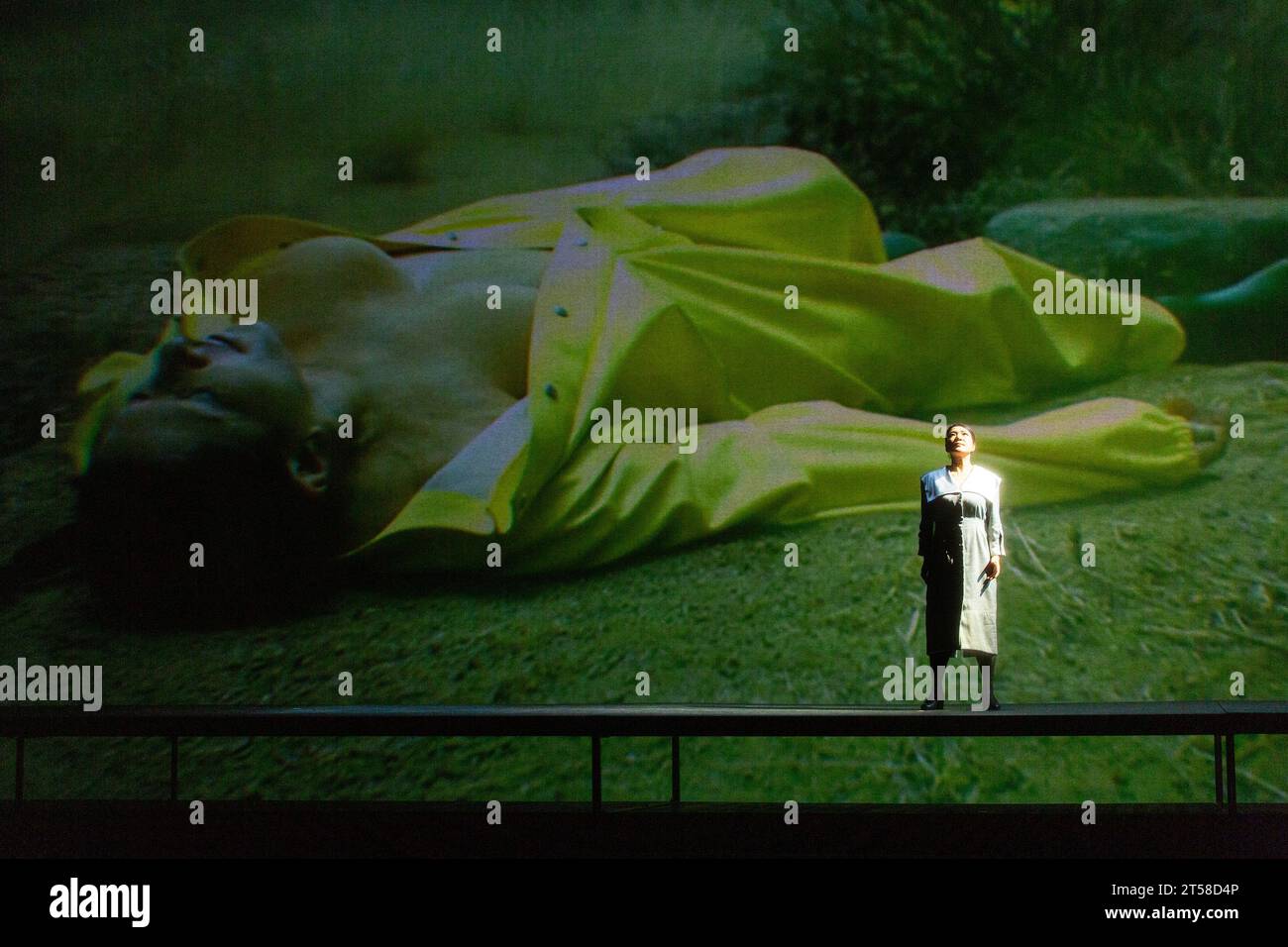 right: Karah Son (as Cio-Cio-San in Madam Butterfly by Puccini) with Marina Abramovic (as Maria Callas) in 7 DEATHS OF MARIA CALLAS at English National Opera (ENO), London Coliseum, London WC2  03/11/2023  with music by Marko Nikodijevic  libretto: Petter Skavlan & Marina Abramovic   conductor: Yoel Gamzou  design: Marina Abramovic & Anna Schoetl  costumes: Riccardo Tisci for Burberry  lighting: Urs Schoenebaum  film director: Nabil Elderkin  visual intermezzos: Marco Brambilla  stage director: Marina Abramovic  NB: image shot through gauze screen Stock Photo