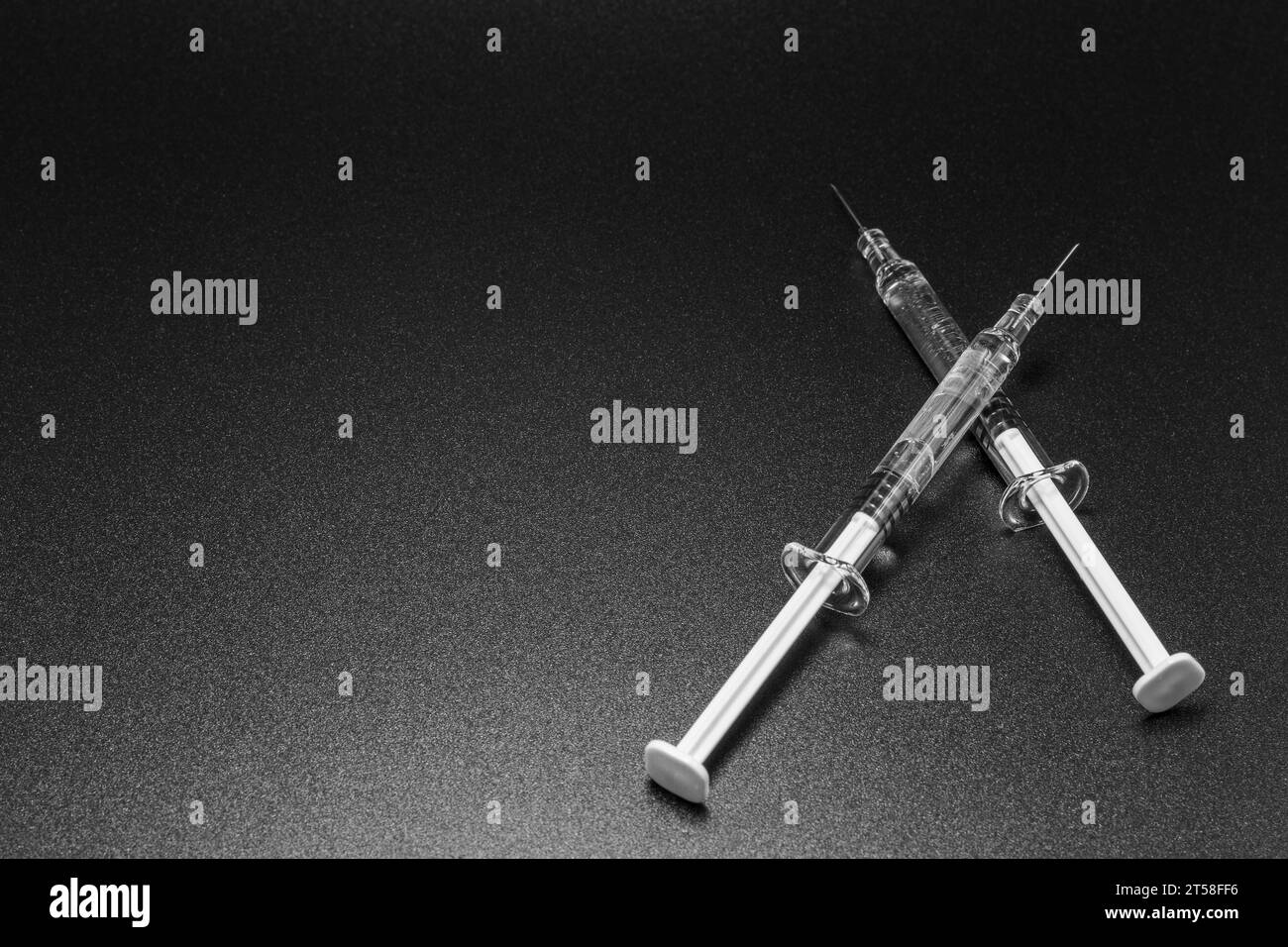 Medical syringes and needles on black background. Medical concept ...