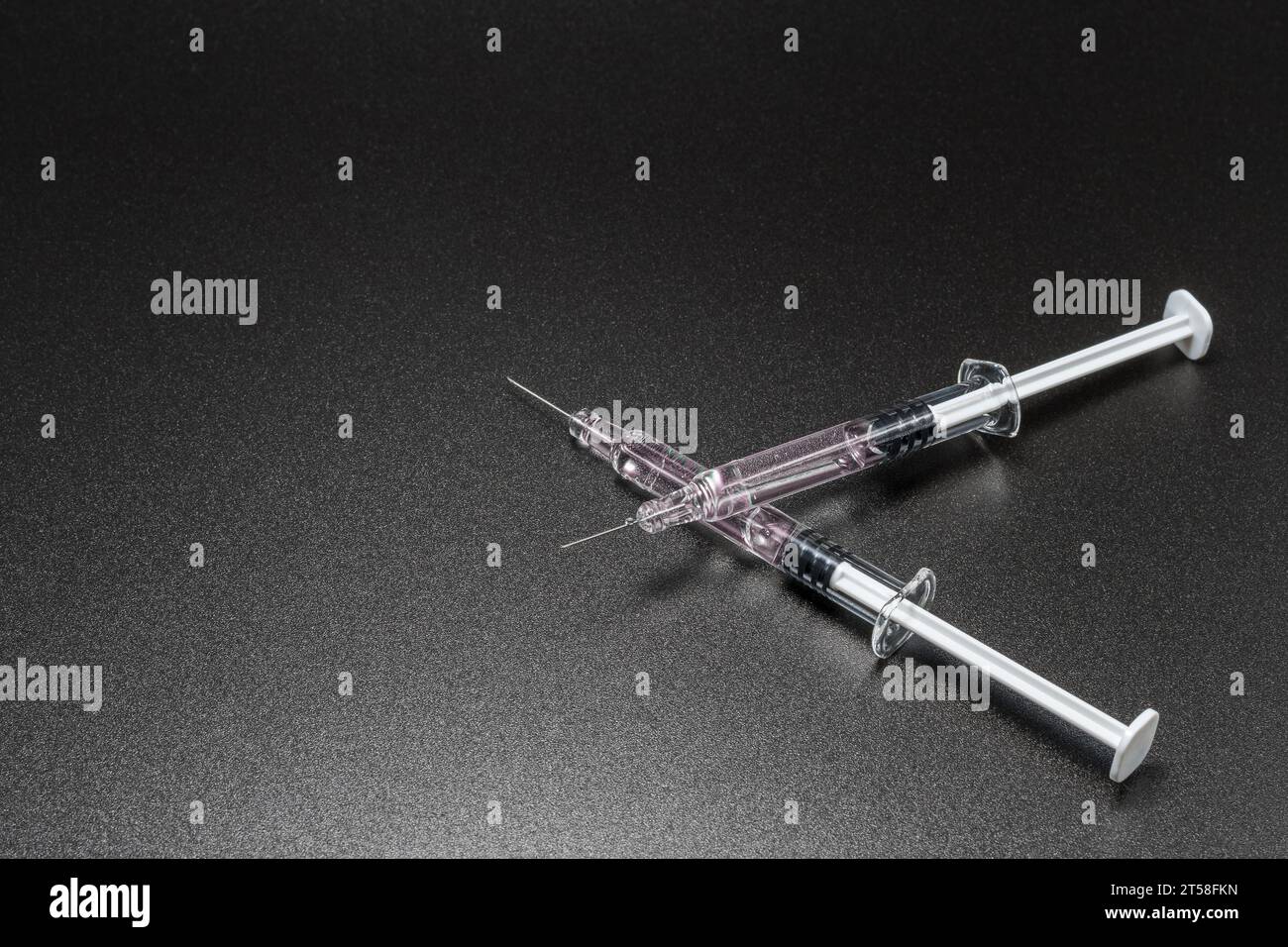 Medical syringes and needles on black background. Medical concept ...