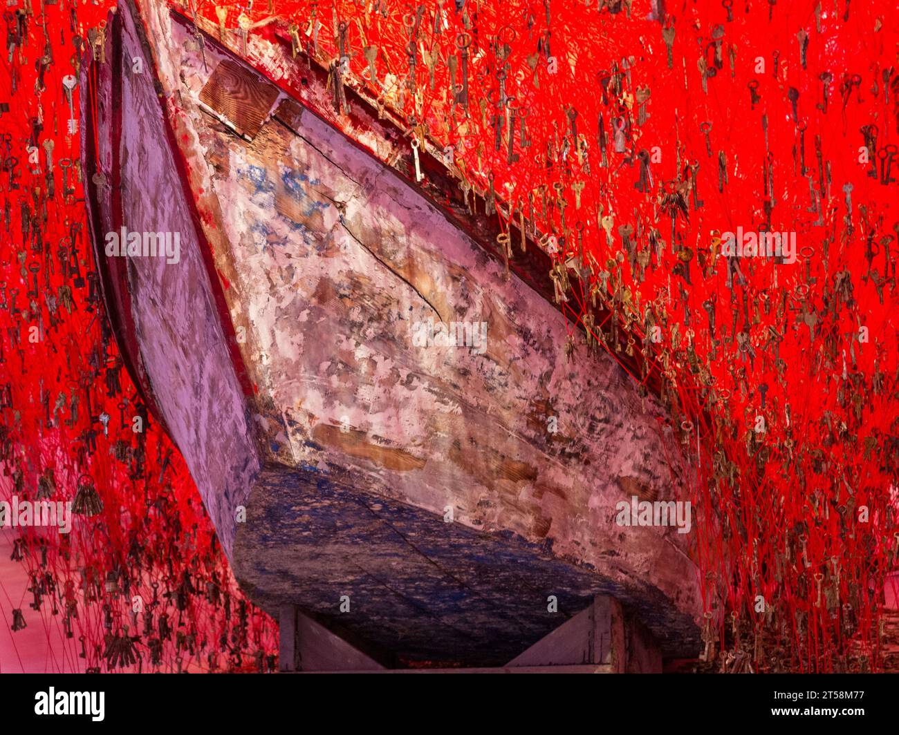 Chiharu Shiota: The key in the hand, Japanese Pavilion, Venice Biennale 2015. Detail of the boat surrounded by red keys. Stock Photo