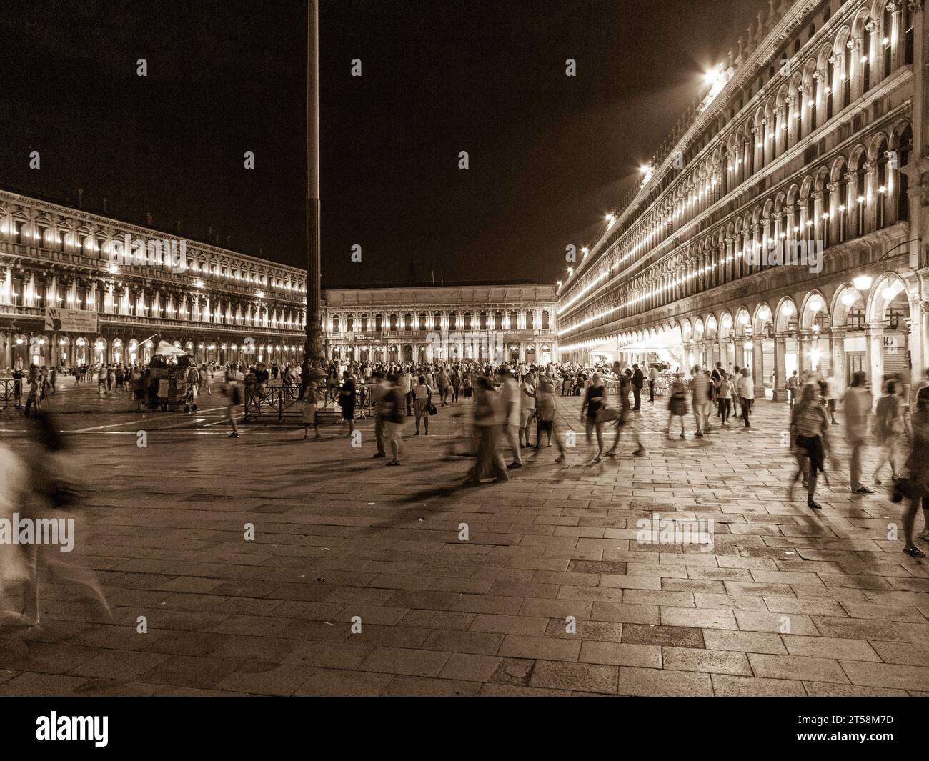 St. Mark's Square in Venice, Italy, at night. Black and white. The square is full of tourists. Stock Photo
