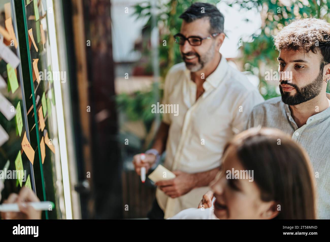 Multiracial business team collaborating in a modern office, discussing ...