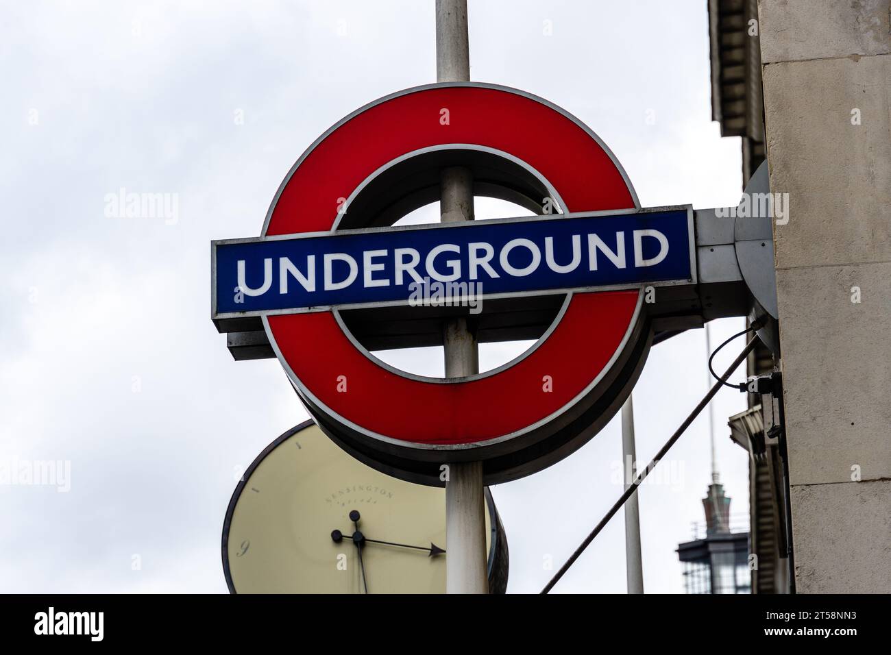 LONDON, UK - August 26, 2023: Close-up view of the London Underground sign and logo against cloudy sky. Concept of public transport Stock Photo