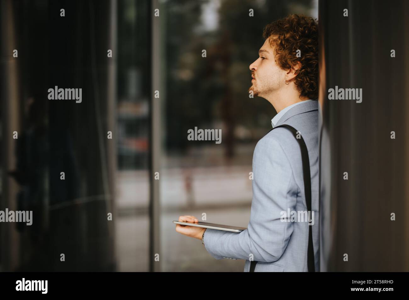 Innovative Architects Collaborating on Construction Blueprint Stock Photo