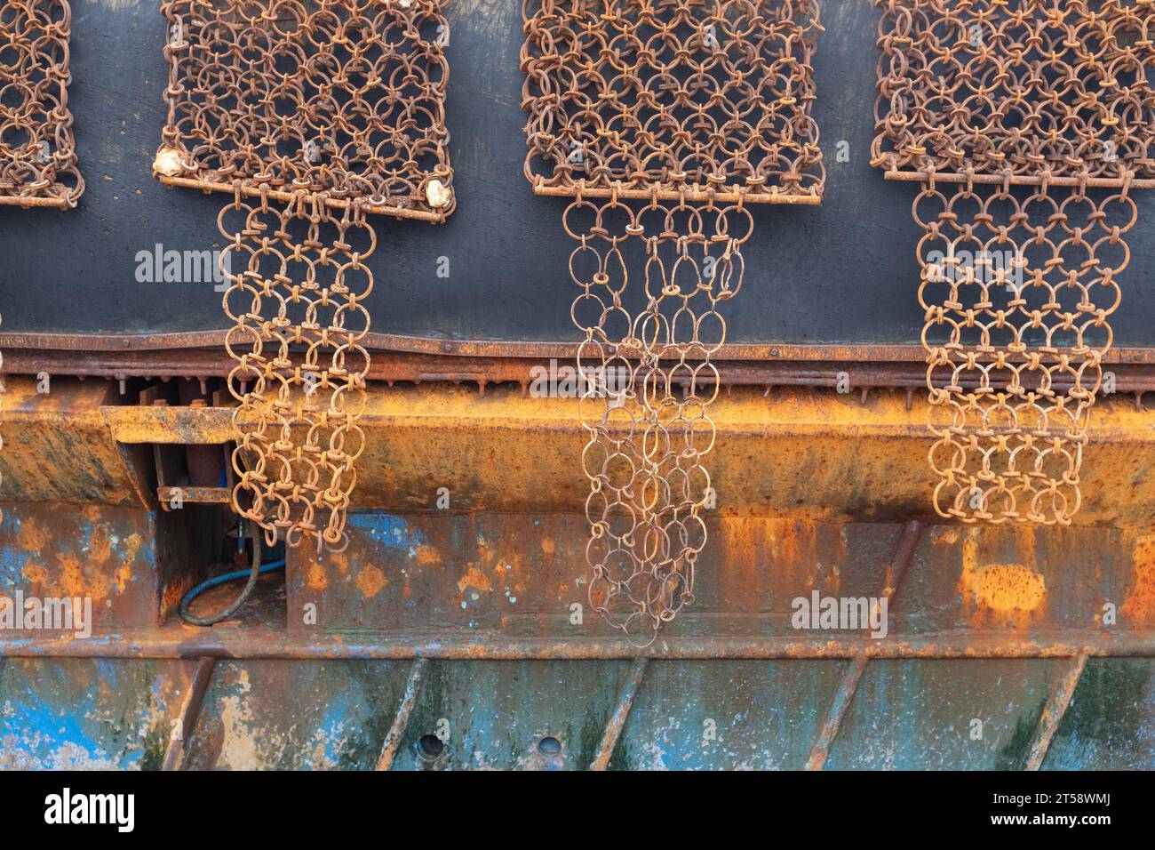 Another side view of a scallop dredging fishing boat showing the heavy duty metal framed nets called scallop dredges, Kirkcudbright, Scotland. Stock Photo