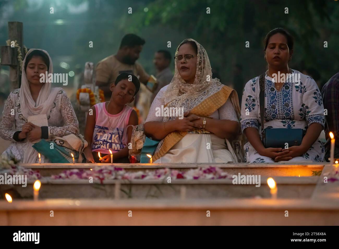 Kolkata, India. 02nd Nov, 2023. An Indian Catholic family lit candles