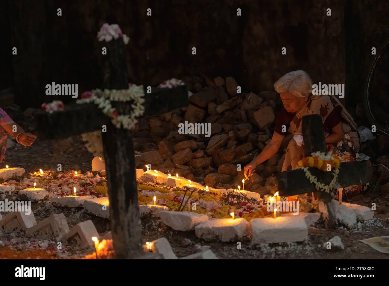 Kolkata, India. 02nd Nov, 2023. An Indian Catholic woman seen lighting