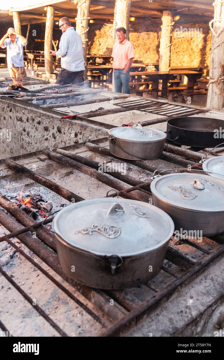 Pots of food on a stove at an outdoor restaurant near Lamberts Bay in
